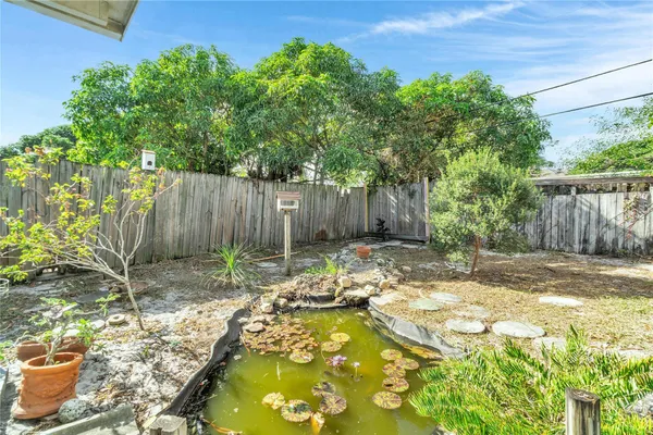 a backyard of a house with yard and outdoor seating