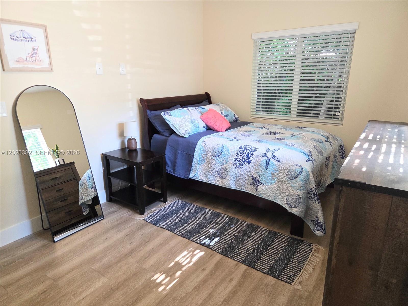 11 Pompano Avenue, Unit 11 Key Largo, FL 33037 - Photo 12 of 15 a bedroom with a bed chair and a window