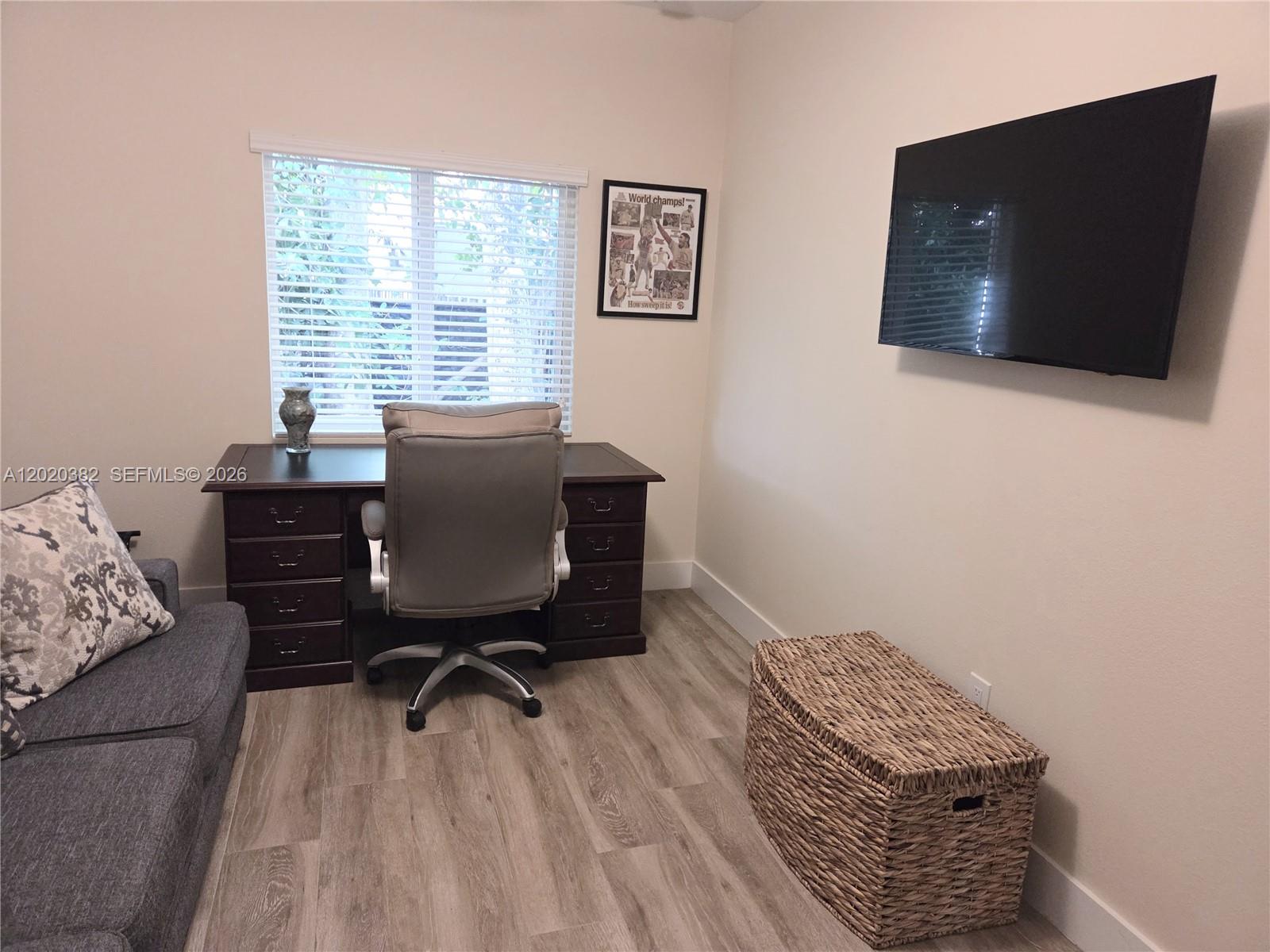 11 Pompano Avenue, Unit 11 Key Largo, FL 33037 - Photo 8 of 15 a living room with furniture and a flat screen tv