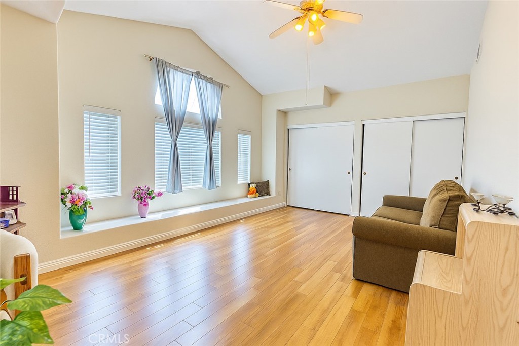 25463 Hardy Place Stevenson Ranch, CA 91381 - Photo 7 of 21 a living room with furniture and a chandelier