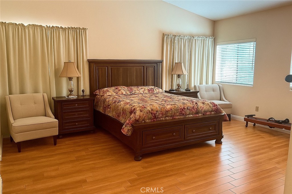 25463 Hardy Place Stevenson Ranch, CA 91381 - Photo 9 of 21 a bed sitting in a spacious bedroom next to a window