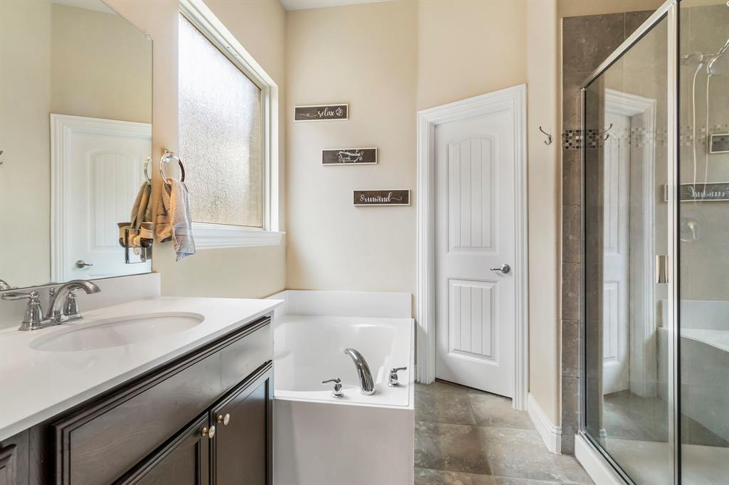 3610 Bastrop Street Melissa, TX 75454 - Photo 17 of 23 a bathroom with a sink a mirror and a bathtub