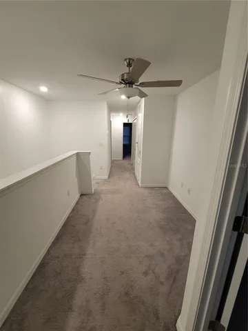 a view of a livingroom with a ceiling fan