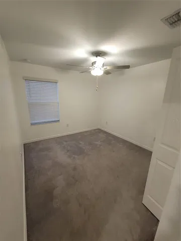 an empty room with a bathroom