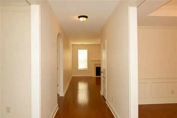 an empty room with wooden floor