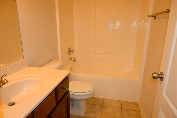 a bathroom with a sink vanity and a mirror