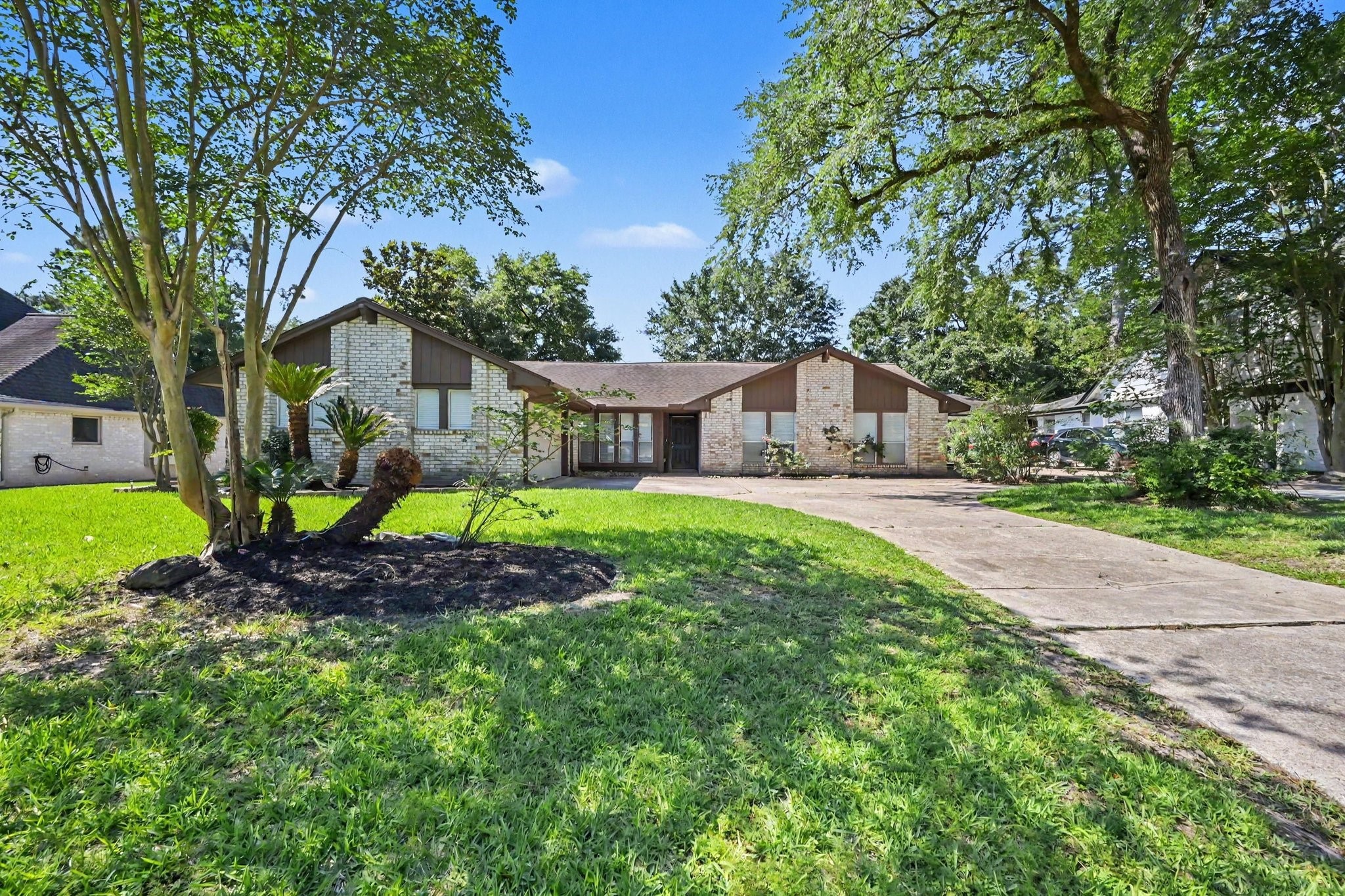 17419 Cassina Drive Spring, TX 77388 - Photo 3 of 35 a house with green field in front of it
