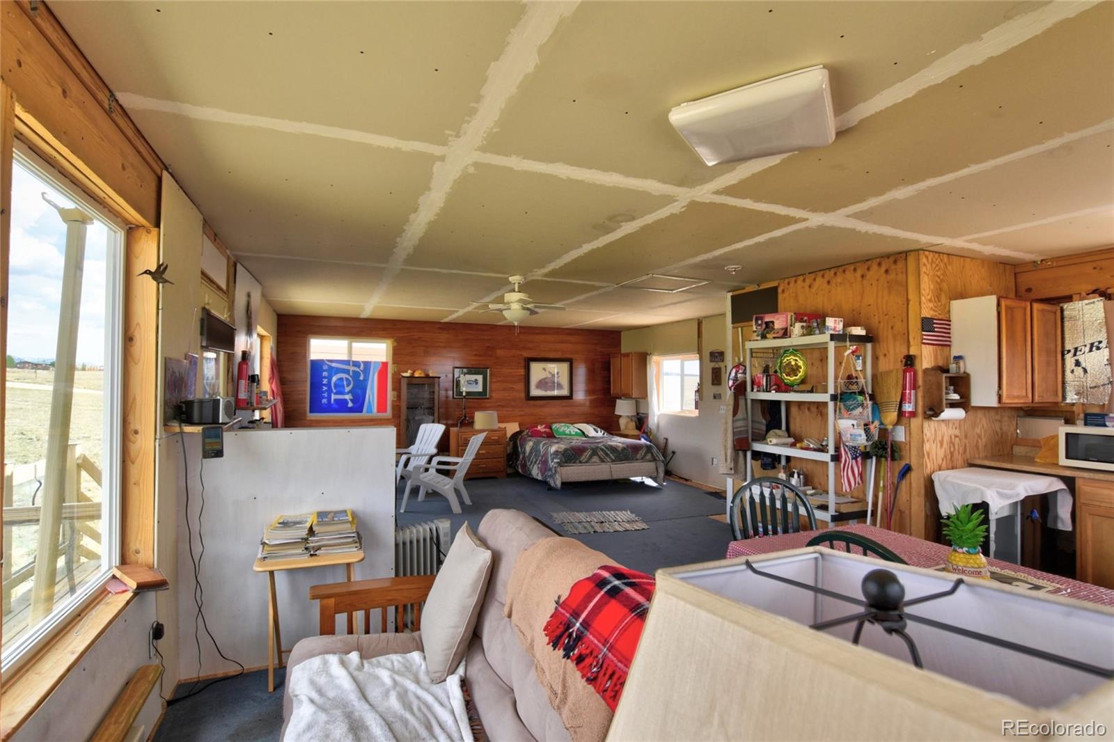 1091 Kokanee Road Fairplay, CO 80440 - Photo 19 of 34 a view of a livingroom with furniture and a window
