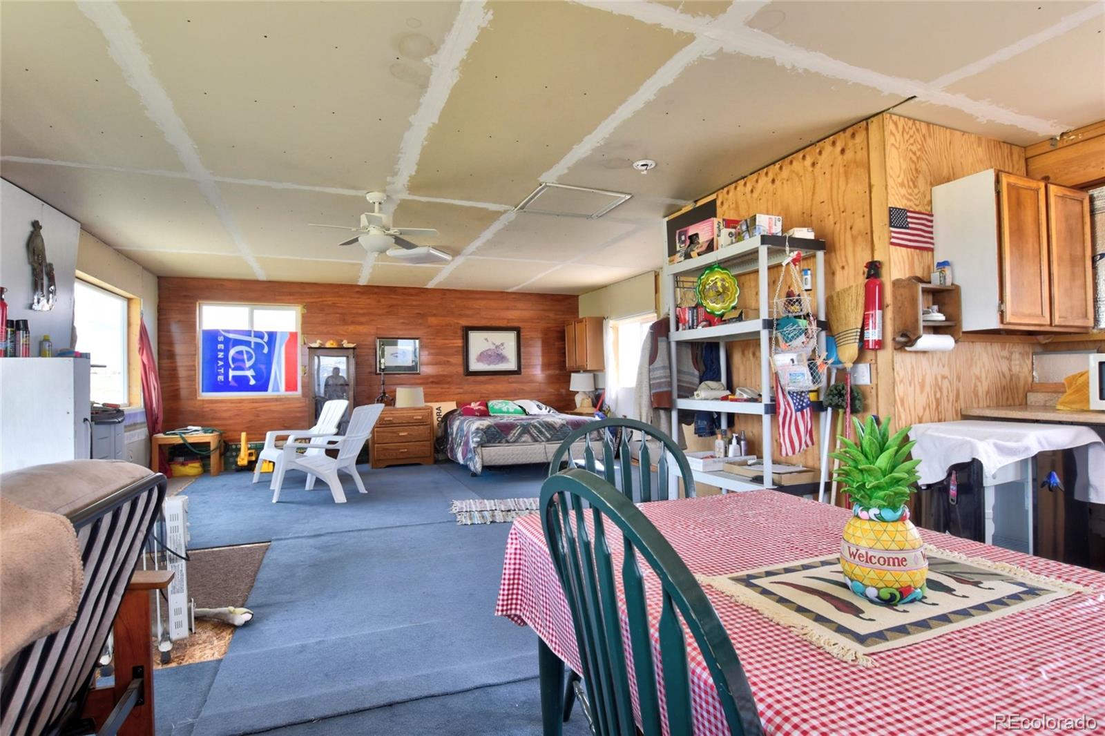 1091 Kokanee Road Fairplay, CO 80440 - Photo 2 of 34 a living room with furniture fireplace and a large window