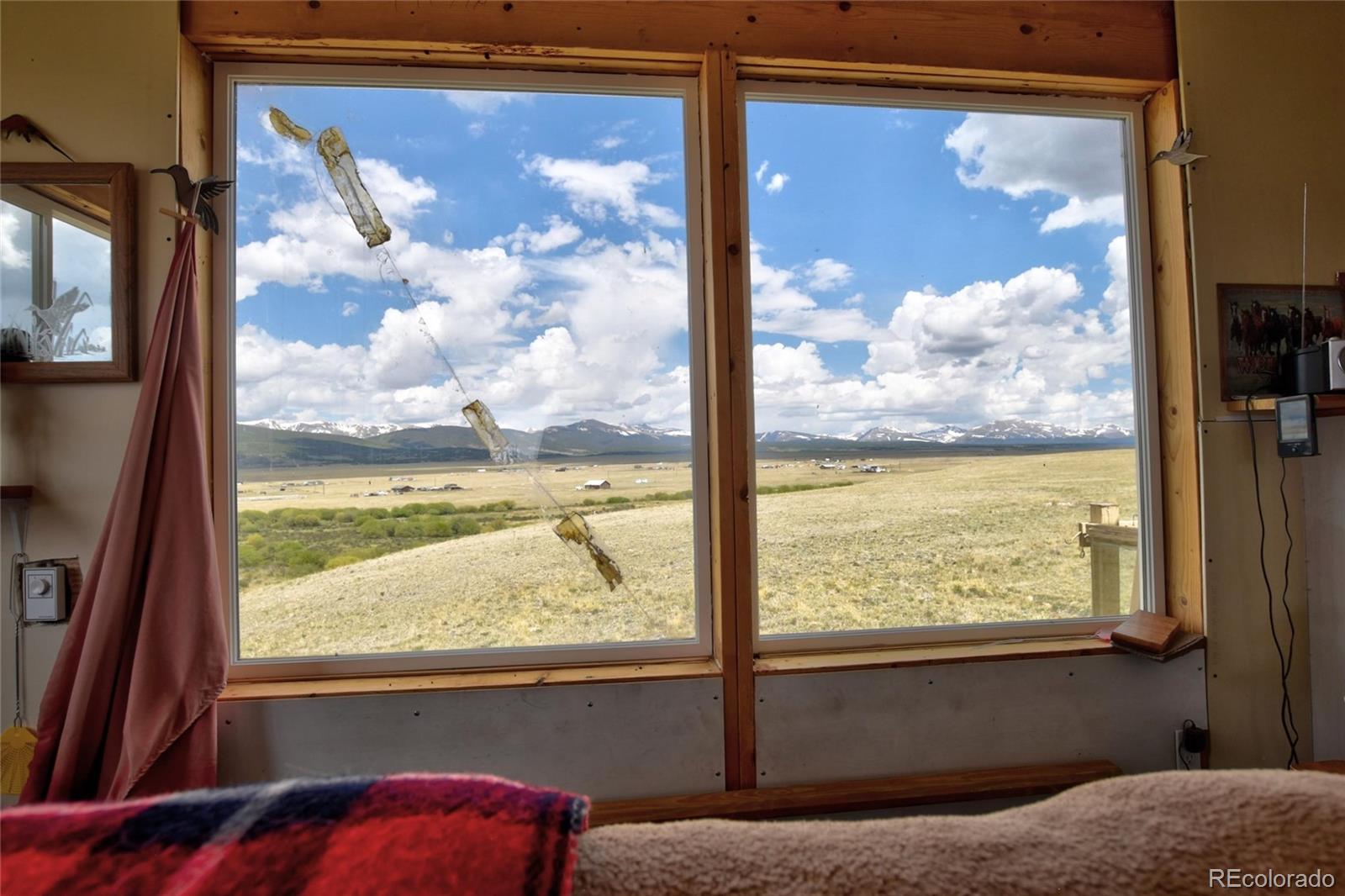 1091 Kokanee Road Fairplay, CO 80440 - Photo 3 of 34 a view of a glass door with a tv from a window