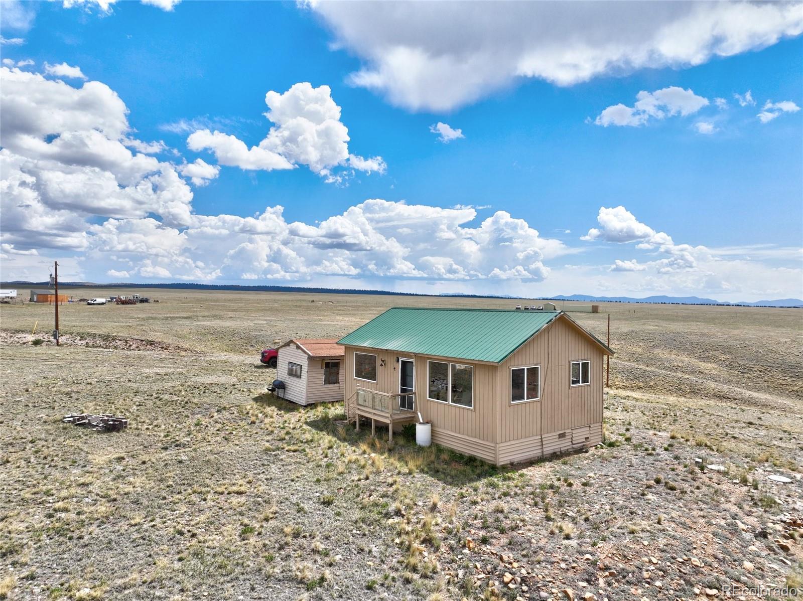 1091 Kokanee Road Fairplay, CO 80440 - Photo 31 of 34 a view of a house with a yard