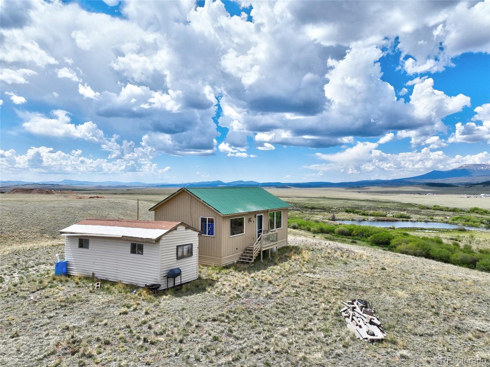 1091 Kokanee Road Fairplay, CO 80440 - Photo 32 of 34 a view of a house with a yard