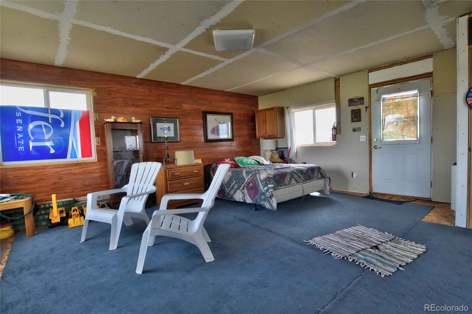1091 Kokanee Road Fairplay, CO 80440 - Photo 8 of 34 a bedroom with furniture and a window