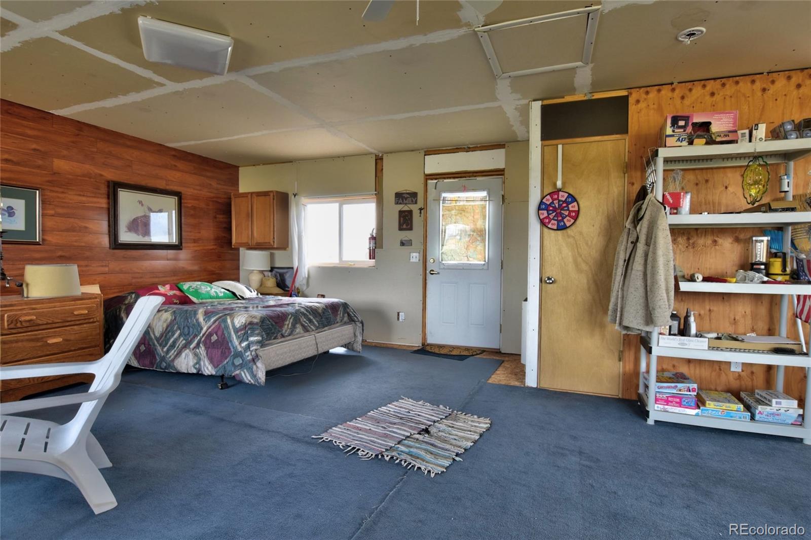 1091 Kokanee Road Fairplay, CO 80440 - Photo 9 of 34 a bedroom with a bed closet and a window