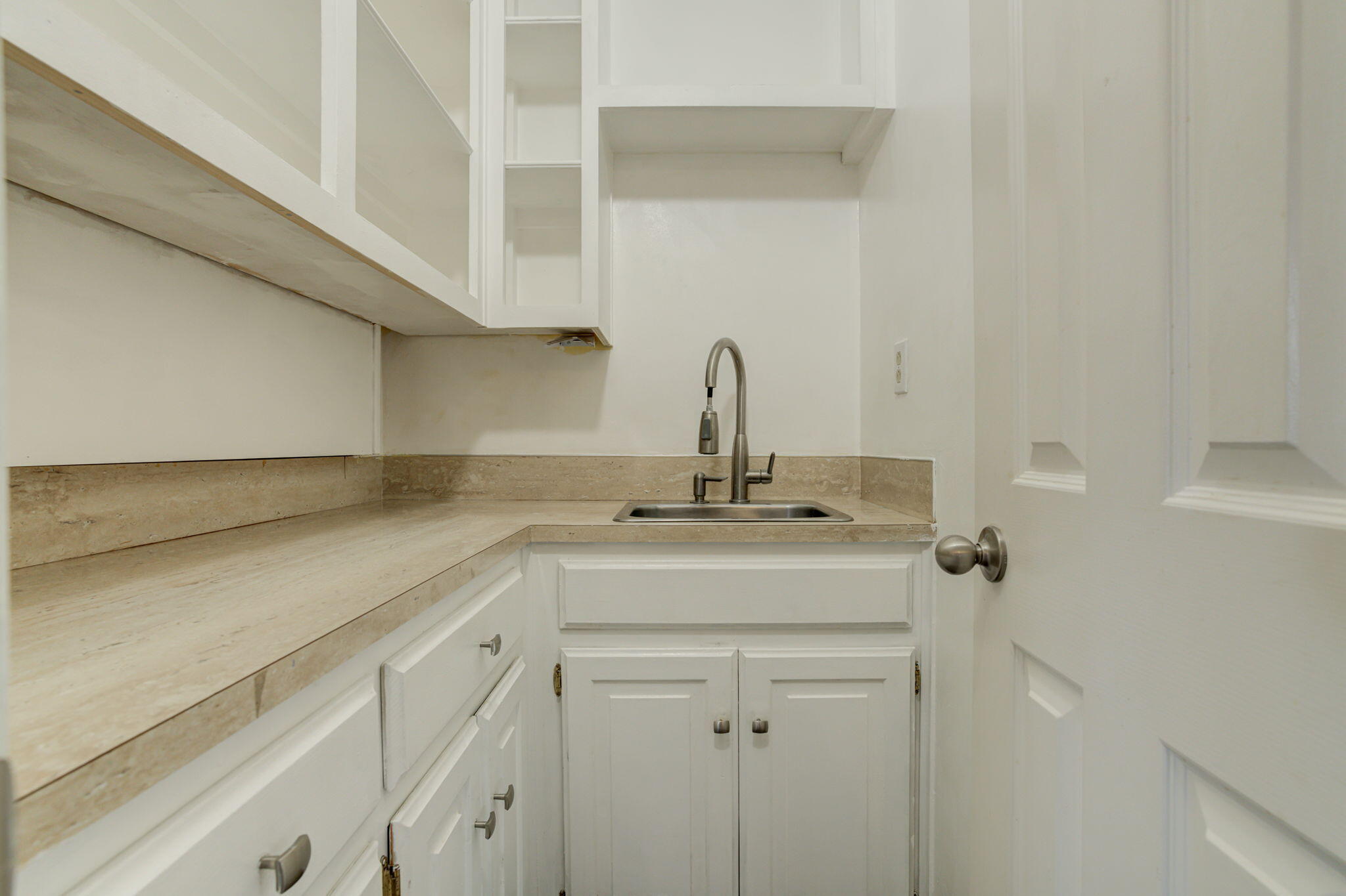 5107 1st Place Lubbock, TX 79416 - Photo 14 of 67 a sink with a mirror