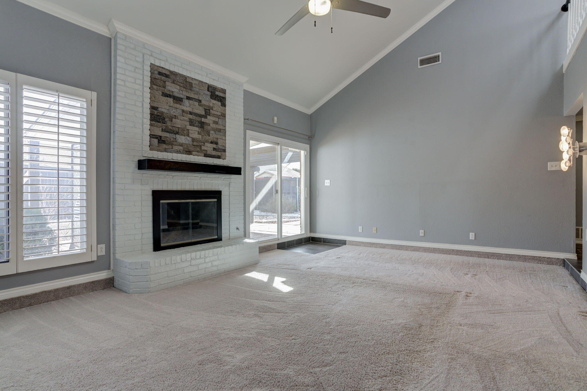5107 1st Place Lubbock, TX 79416 - Photo 24 of 67 an empty room with windows and fireplace
