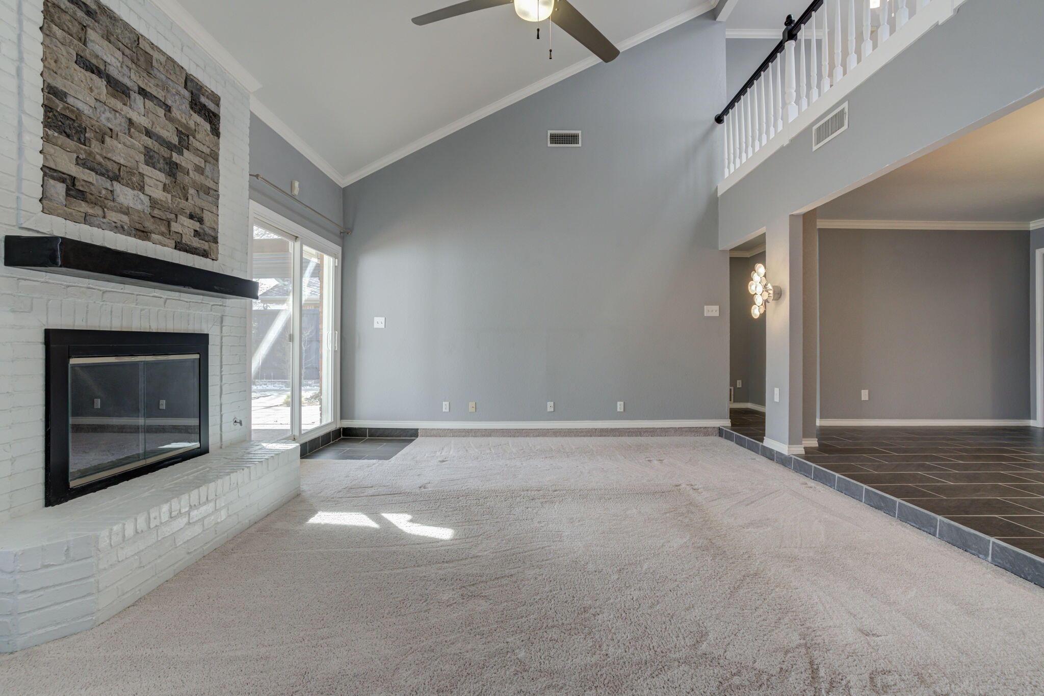 5107 1st Place Lubbock, TX 79416 - Photo 28 of 67 an empty room with windows and fireplace
