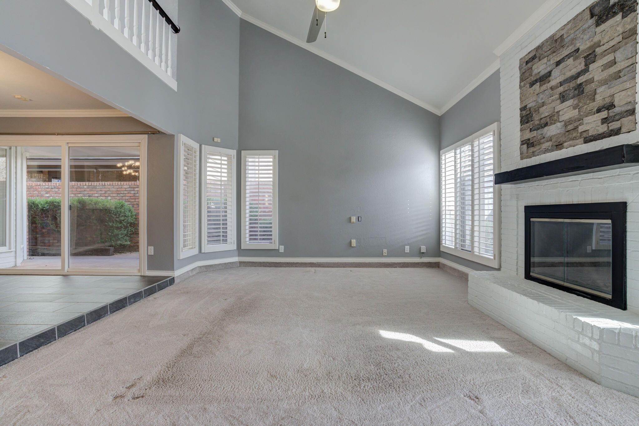 5107 1st Place Lubbock, TX 79416 - Photo 29 of 67 an empty room with windows and fireplace