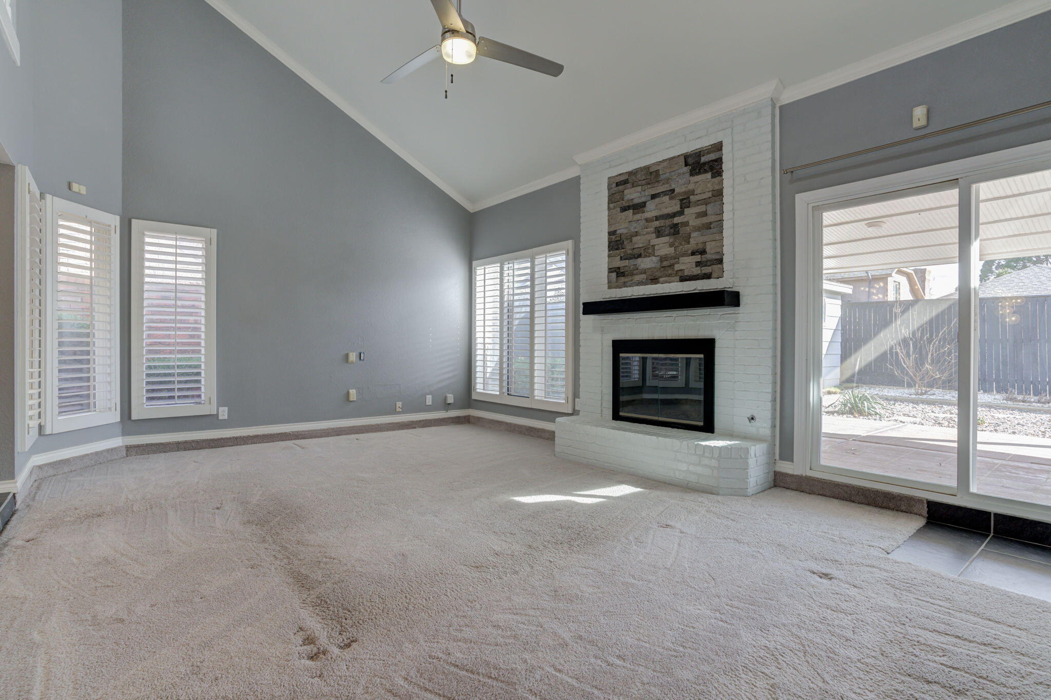 5107 1st Place Lubbock, TX 79416 - Photo 30 of 67 an empty room with windows and fireplace