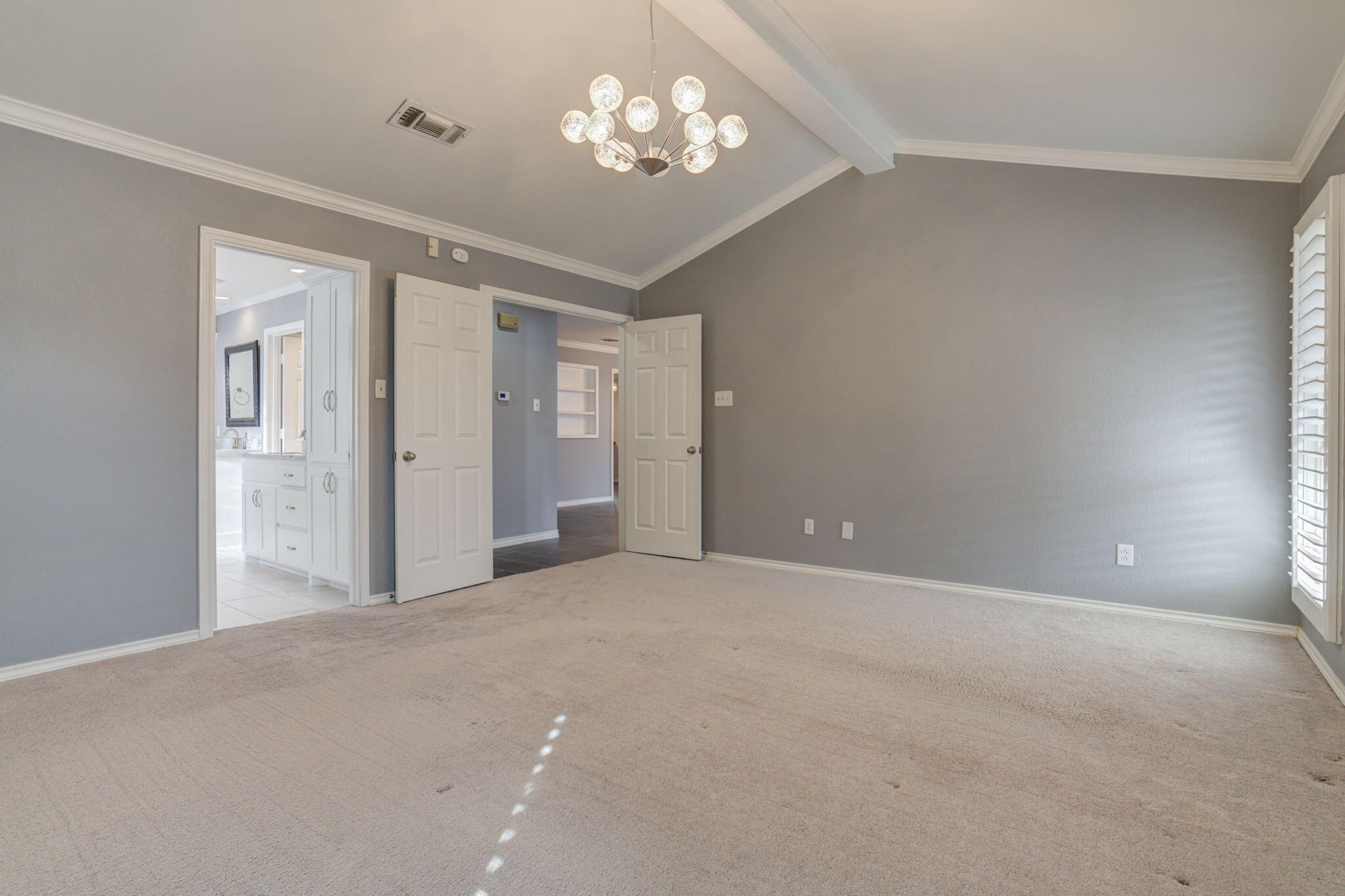 5107 1st Place Lubbock, TX 79416 - Photo 34 of 67 a view of an empty room with a chandelier fan
