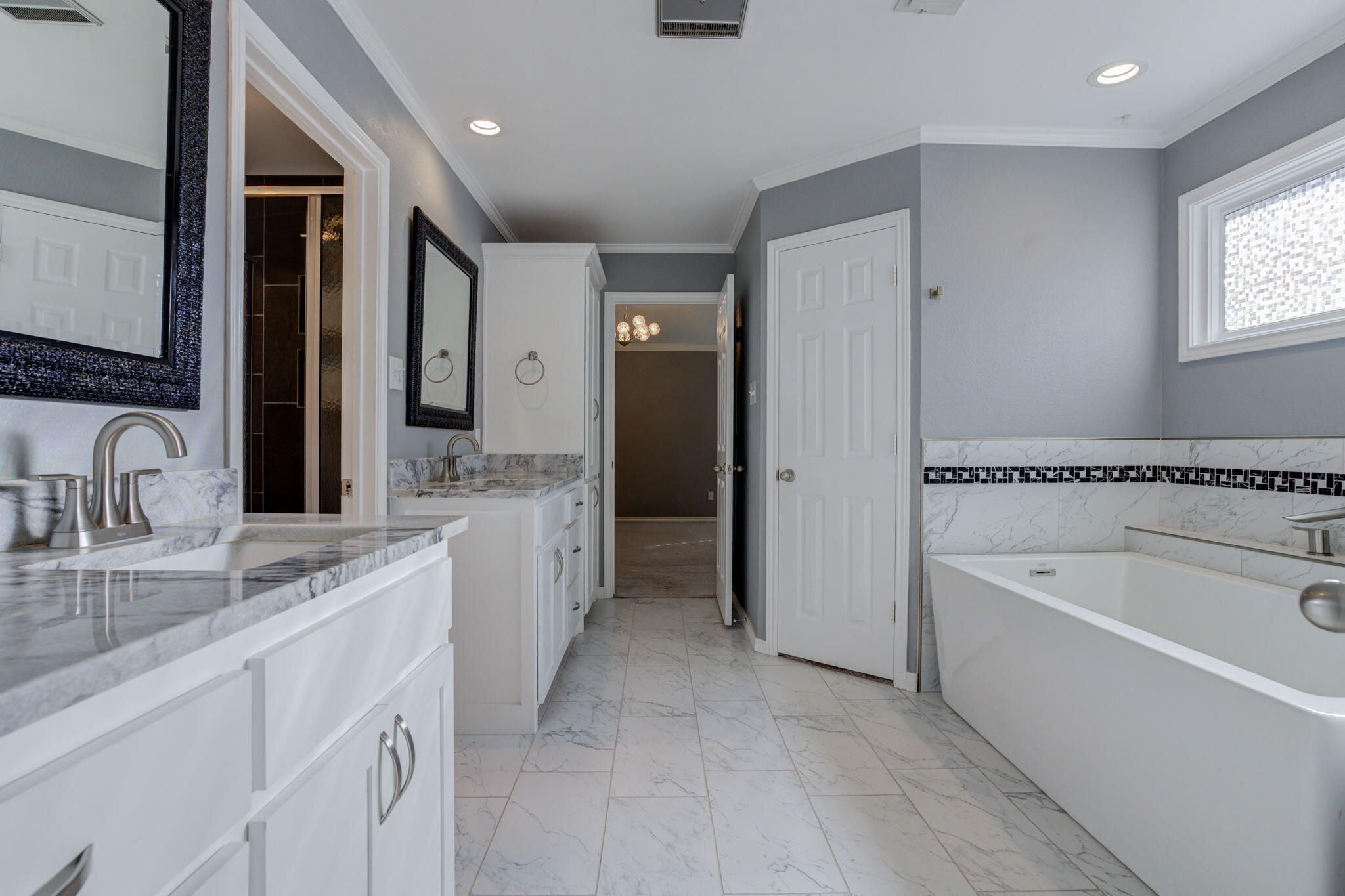 5107 1st Place Lubbock, TX 79416 - Photo 37 of 67 a spacious bathroom with a granite countertop sink mirror and bathtub