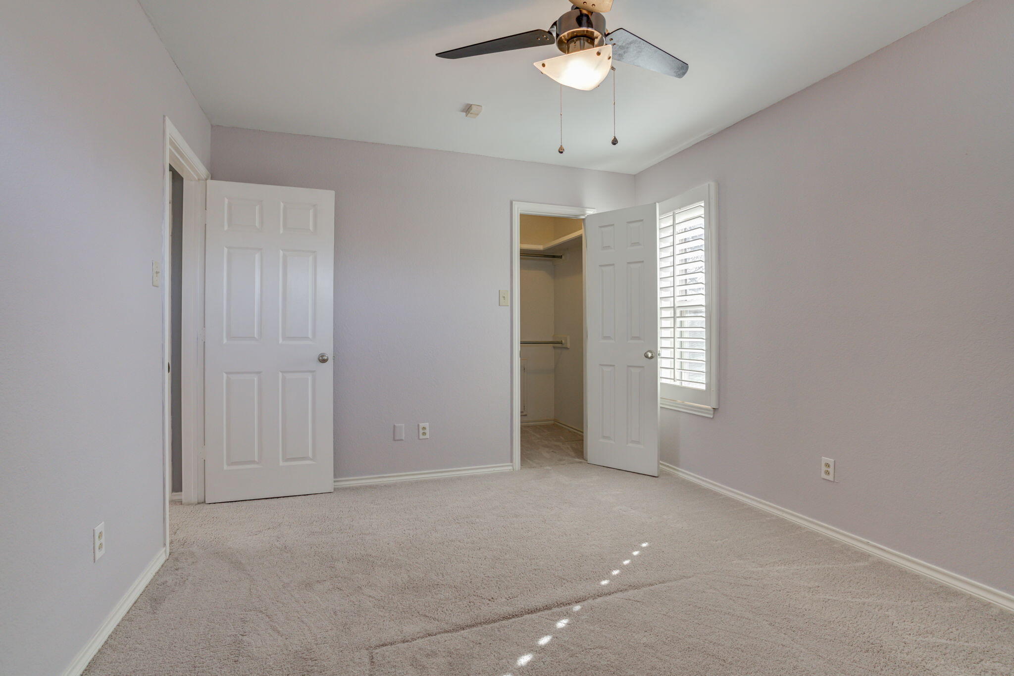 5107 1st Place Lubbock, TX 79416 - Photo 50 of 67 an empty room with windows and fan