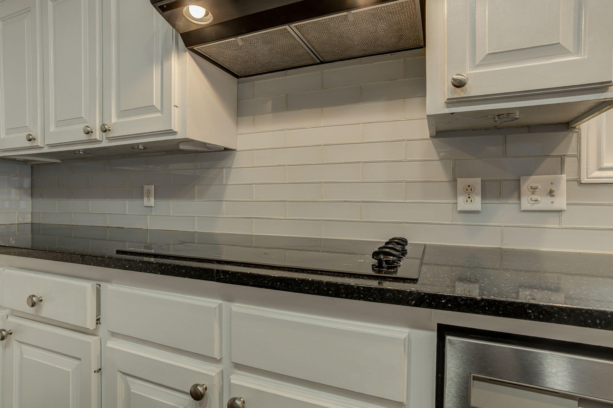 5107 1st Place Lubbock, TX 79416 - Photo 8 of 67 a close view of a sink and dishwasher in a kitchen