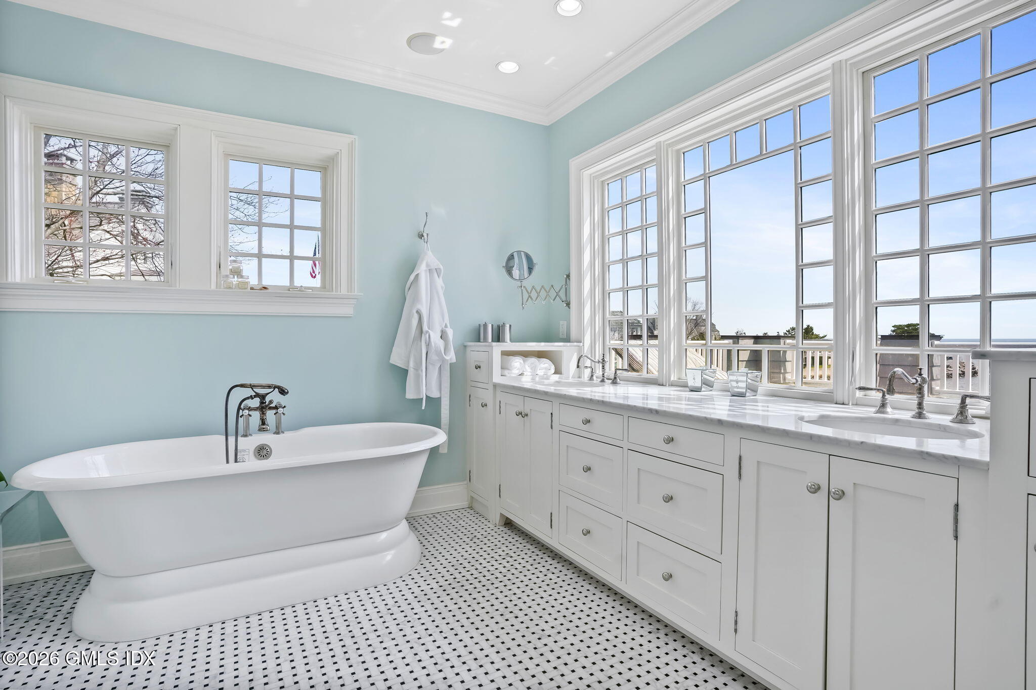 200 Shore Road Old Greenwich, CT 06870 - Photo 15 of 34 a bathroom with a sink and a mirror