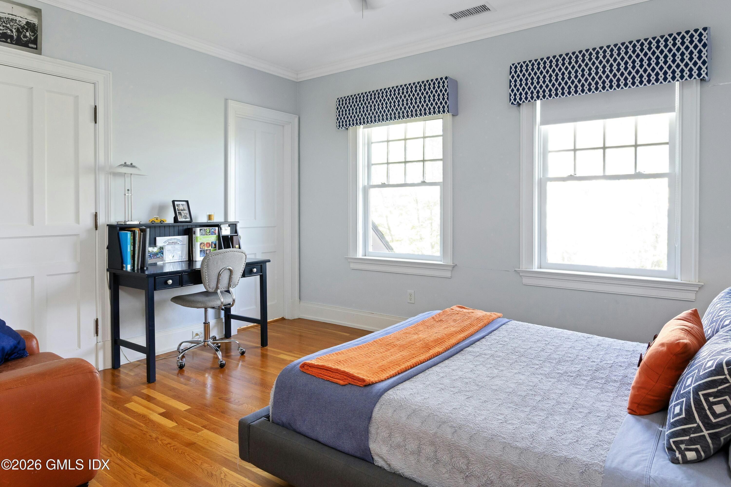 200 Shore Road Old Greenwich, CT 06870 - Photo 19 of 34 a bedroom with furniture and a window