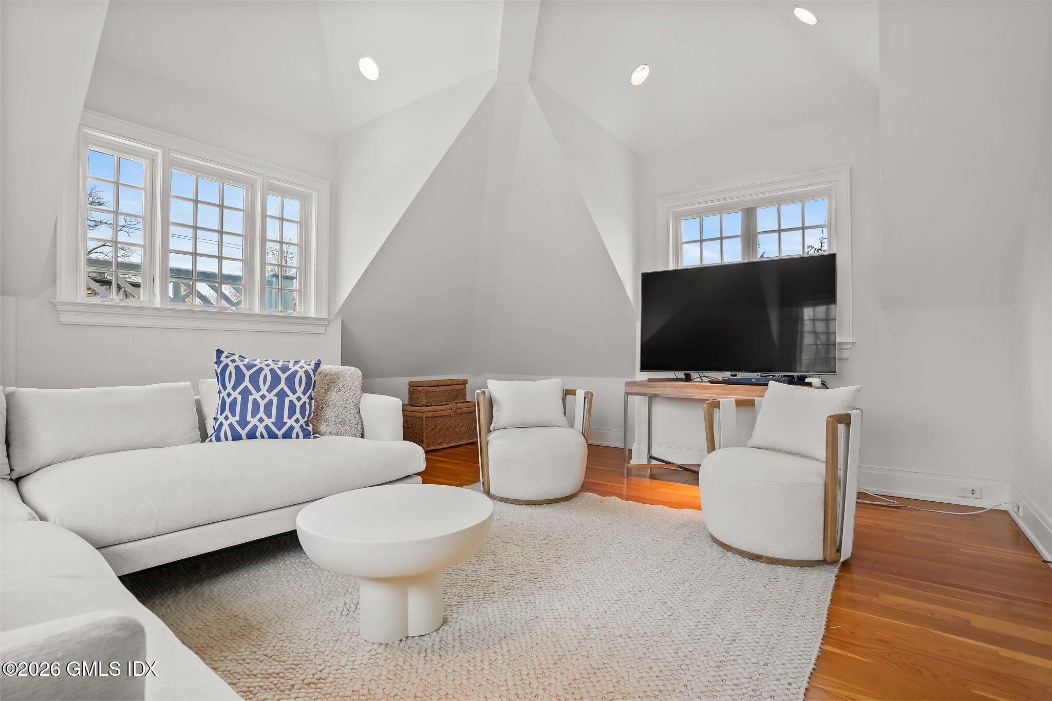 200 Shore Road Old Greenwich, CT 06870 - Photo 21 of 34 a living room with furniture and a flat screen tv