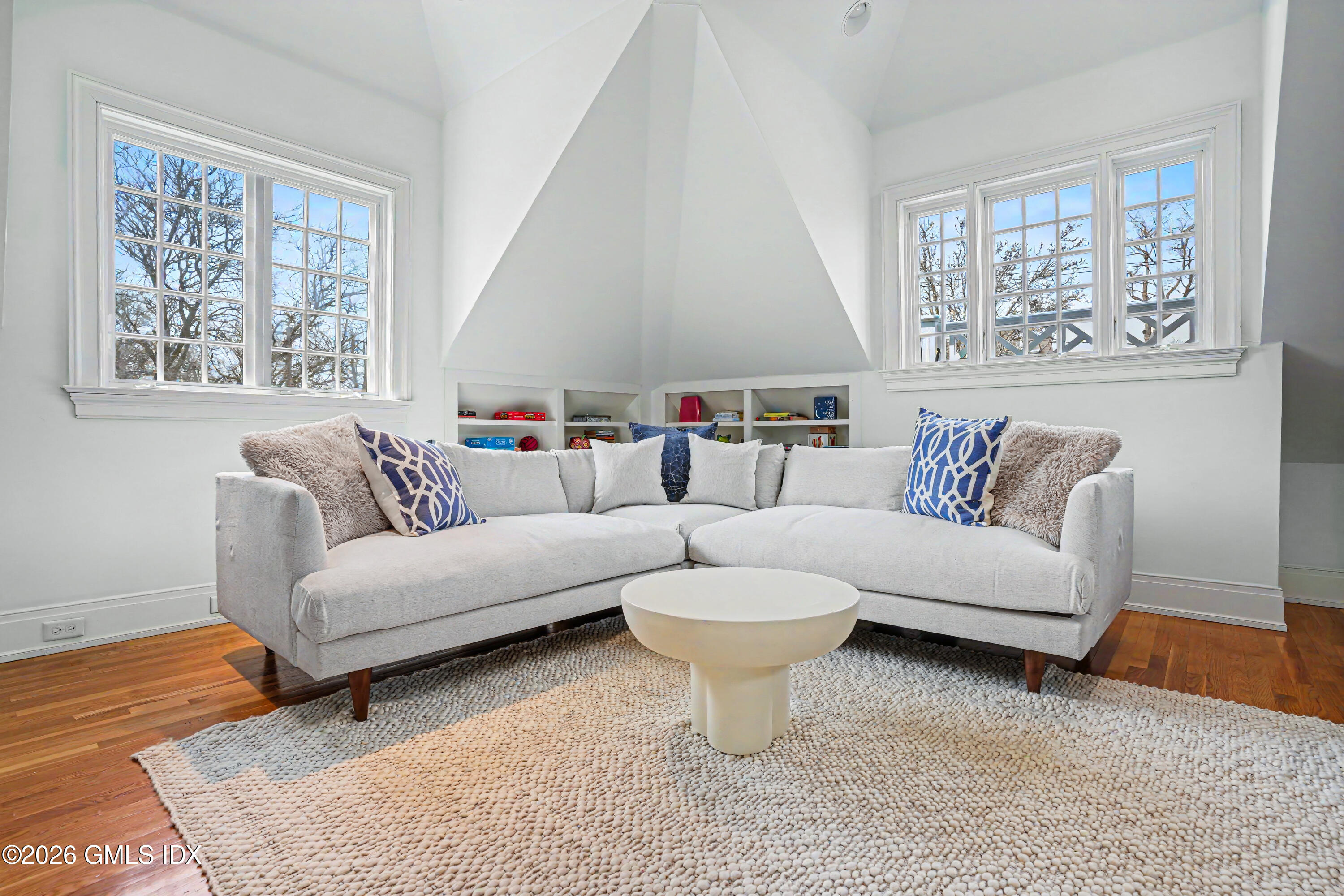 200 Shore Road Old Greenwich, CT 06870 - Photo 22 of 34 a living room with furniture and a large window