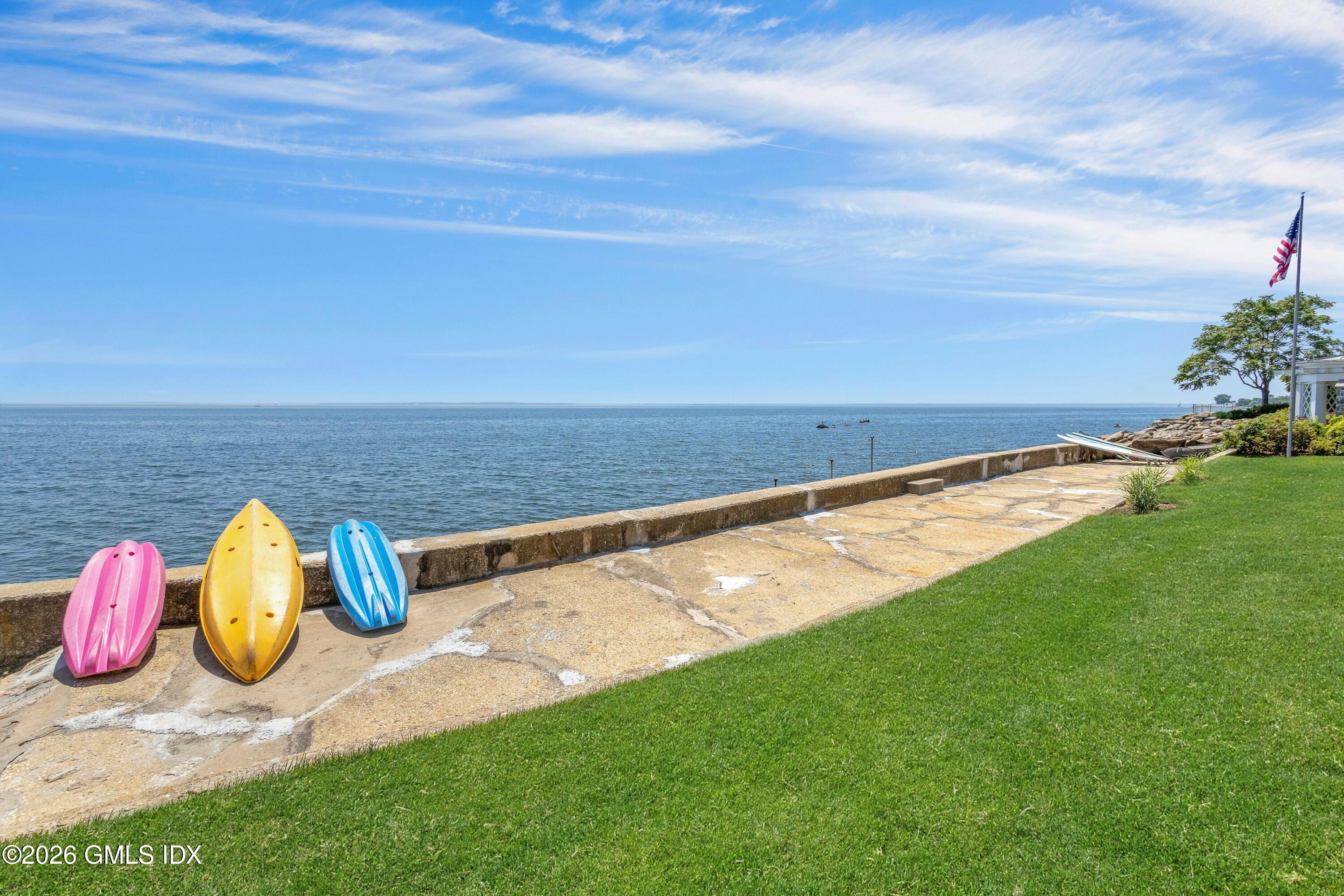 200 Shore Road Old Greenwich, CT 06870 - Photo 26 of 34 a view of a yard with an ocean view