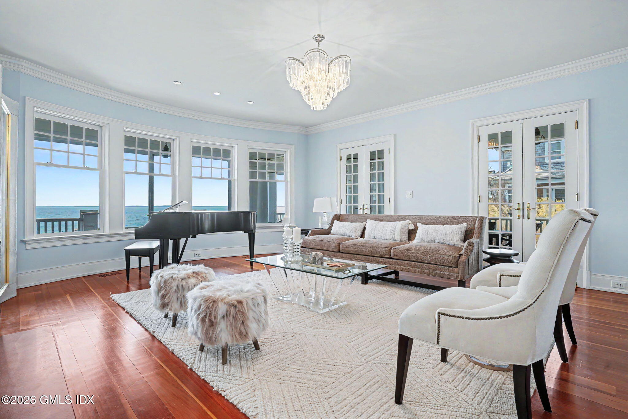 200 Shore Road Old Greenwich, CT 06870 - Photo 4 of 34 a living room with furniture and a large window