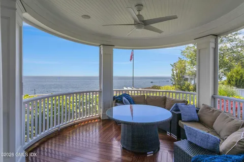 a view of a balcony with furniture