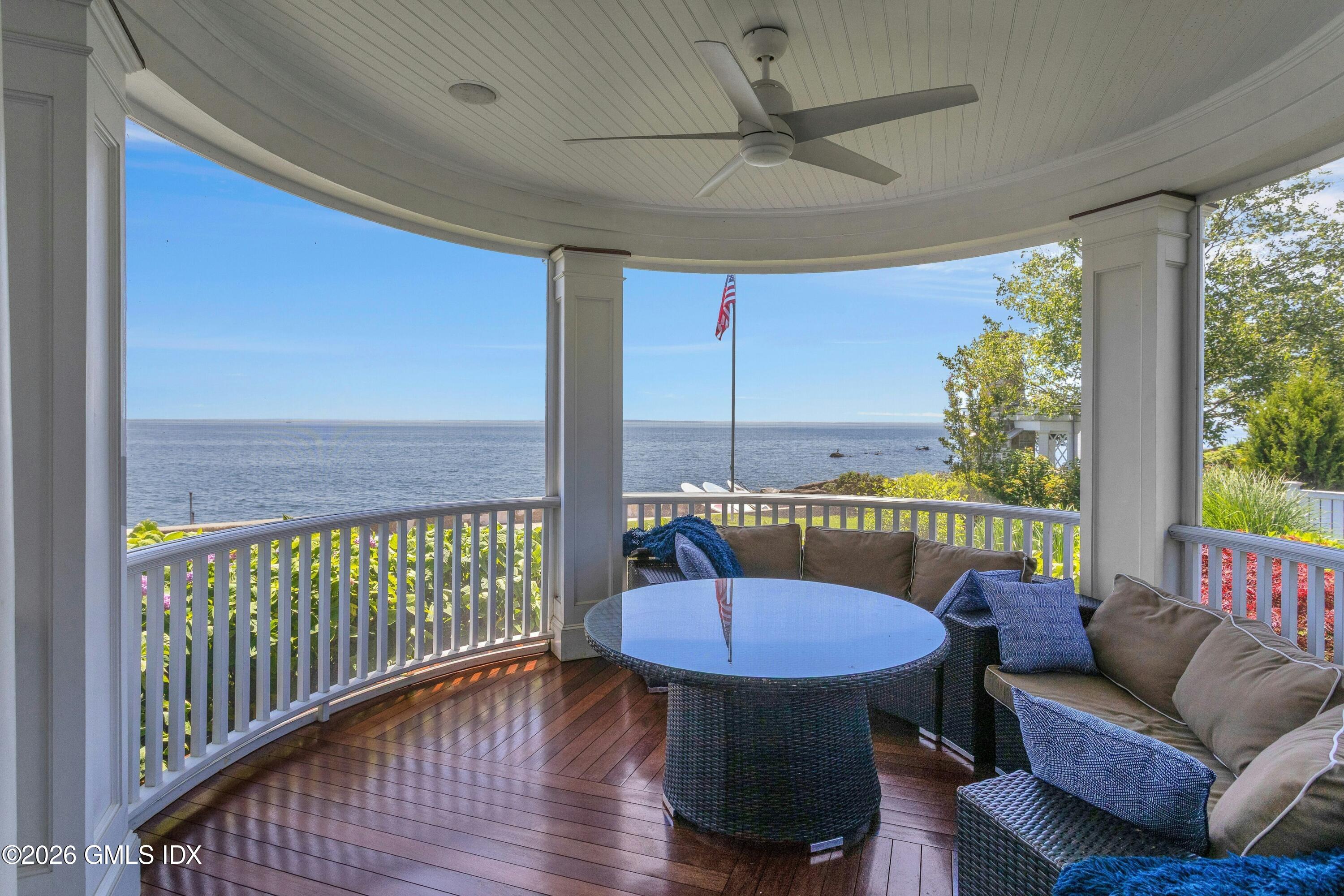 200 Shore Road Old Greenwich, CT 06870 - Photo 8 of 34 a view of a balcony with furniture