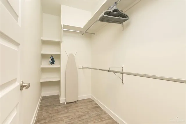 a view of an empty walk in closet