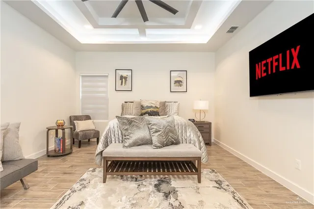 a living room with furniture and a rug