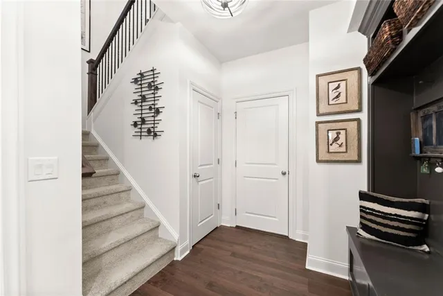 a dining room with furniture a chandelier and window