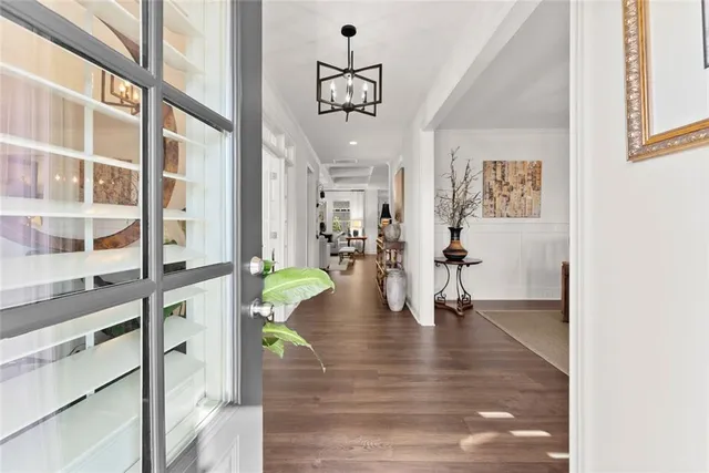 a view of an entryway with wooden floor