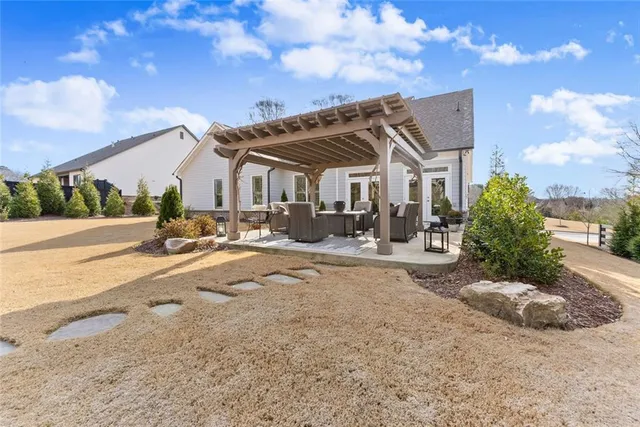 an aerial view of a house with a ocean view