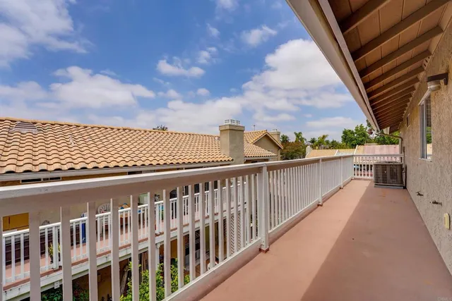 a view of a balcony with wooden floor