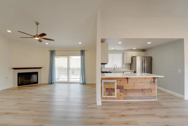 a view of kitchen with cabinets and wooden floor