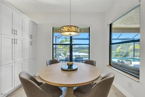 a dining room with furniture and window