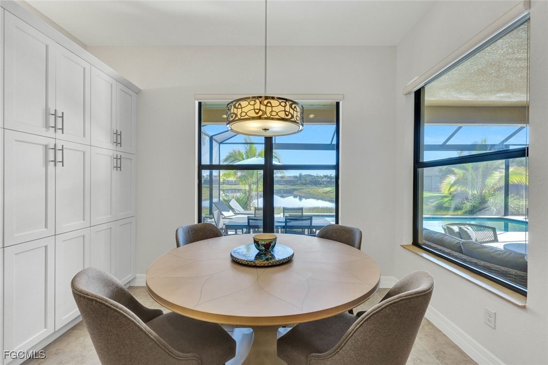11725 Stonecreek Circle Fort Myers, FL 33913 - Photo 11 of 40 a dining room with furniture and window
