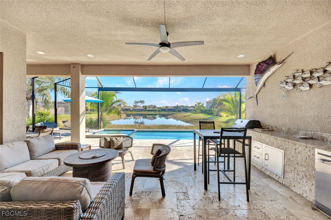 11725 Stonecreek Circle Fort Myers, FL 33913 - Photo 12 of 40 a dining room with furniture a rug and a chandelier