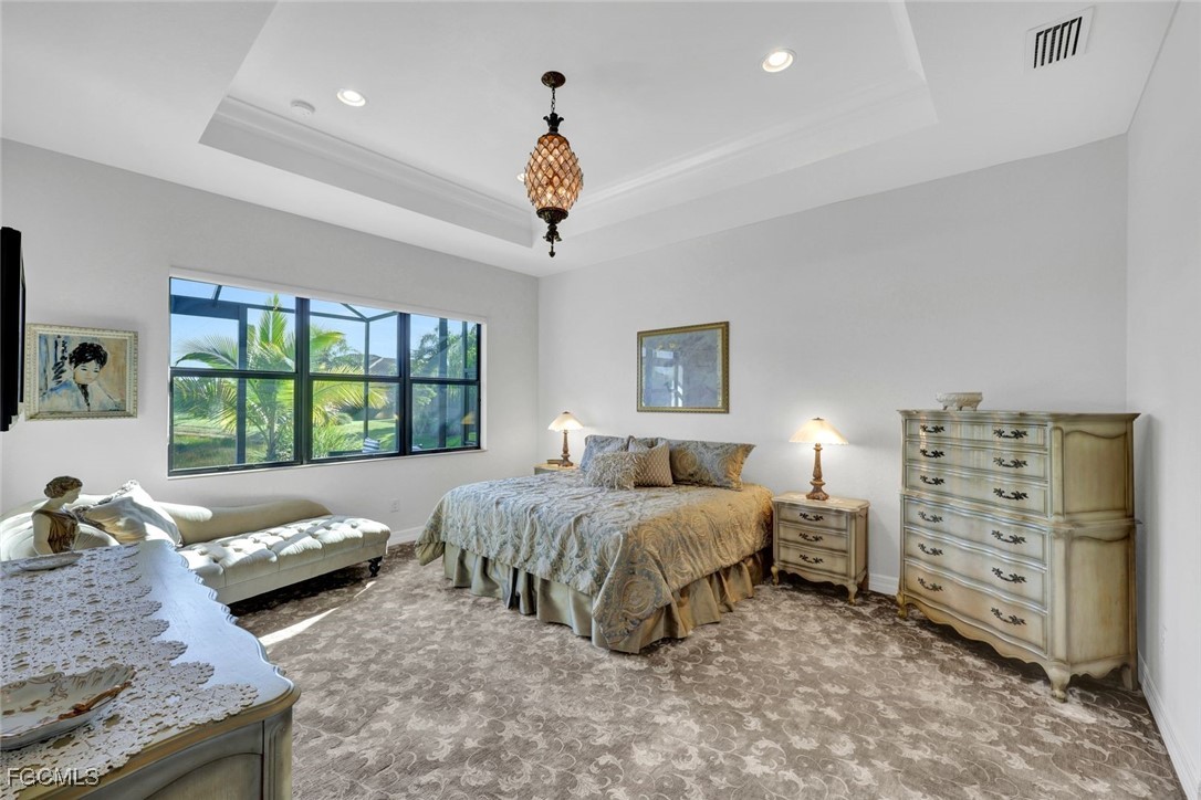 11725 Stonecreek Circle Fort Myers, FL 33913 - Photo 14 of 40 a bedroom with a bed and a window