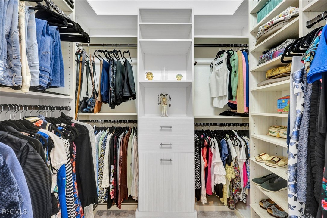 11725 Stonecreek Circle Fort Myers, FL 33913 - Photo 16 of 40 a view of walk in closet with clothes and shoes