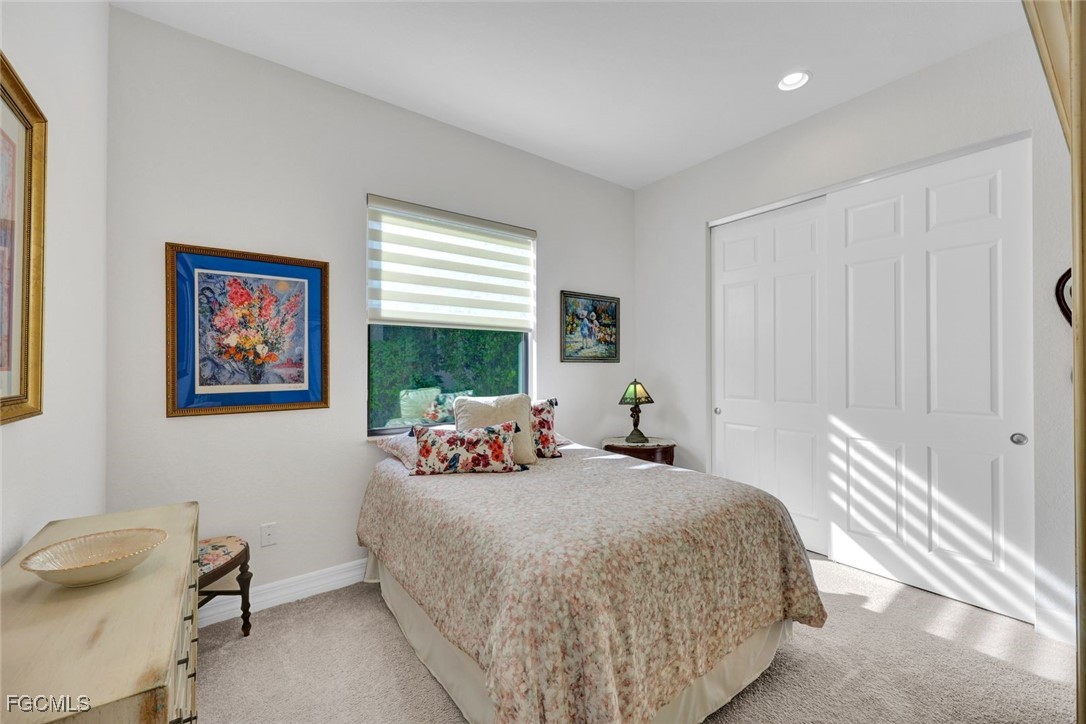 11725 Stonecreek Circle Fort Myers, FL 33913 - Photo 19 of 40 a bed room with a bed and a chair