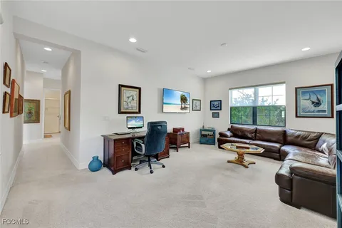a living room with furniture window and work place