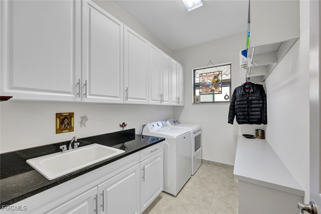 11725 Stonecreek Circle Fort Myers, FL 33913 - Photo 26 of 40 a kitchen with a sink and cabinets